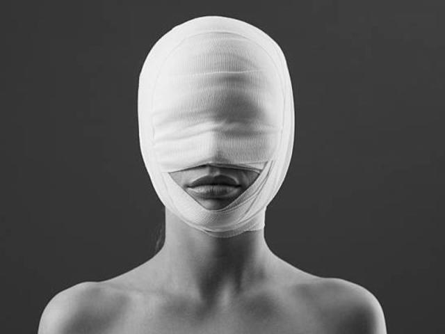 Woman with bandaged face
